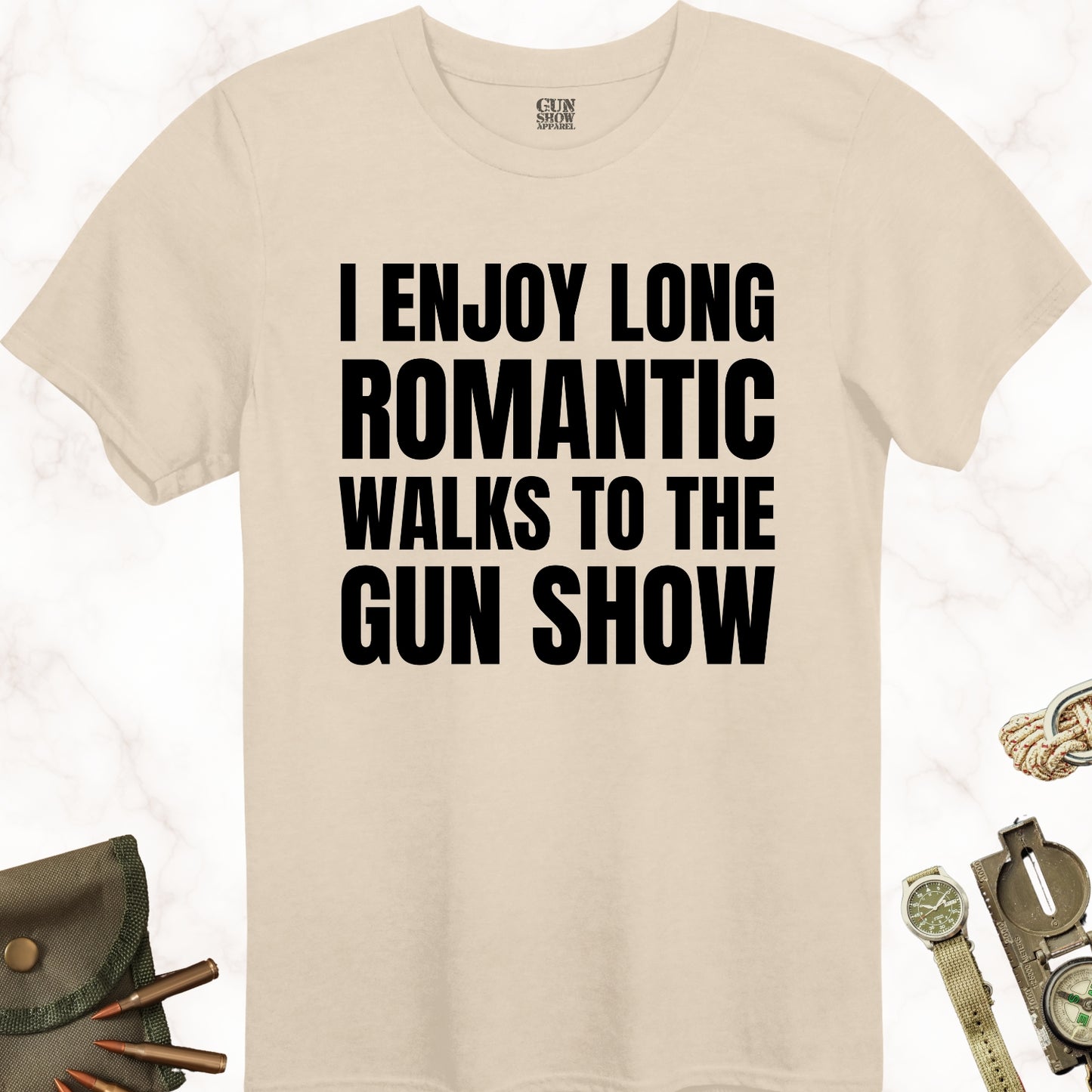 I Enjoy Long Romantic Walks to the Gun Show T-Shirt in color Sand with black design from Gun Show Apparel