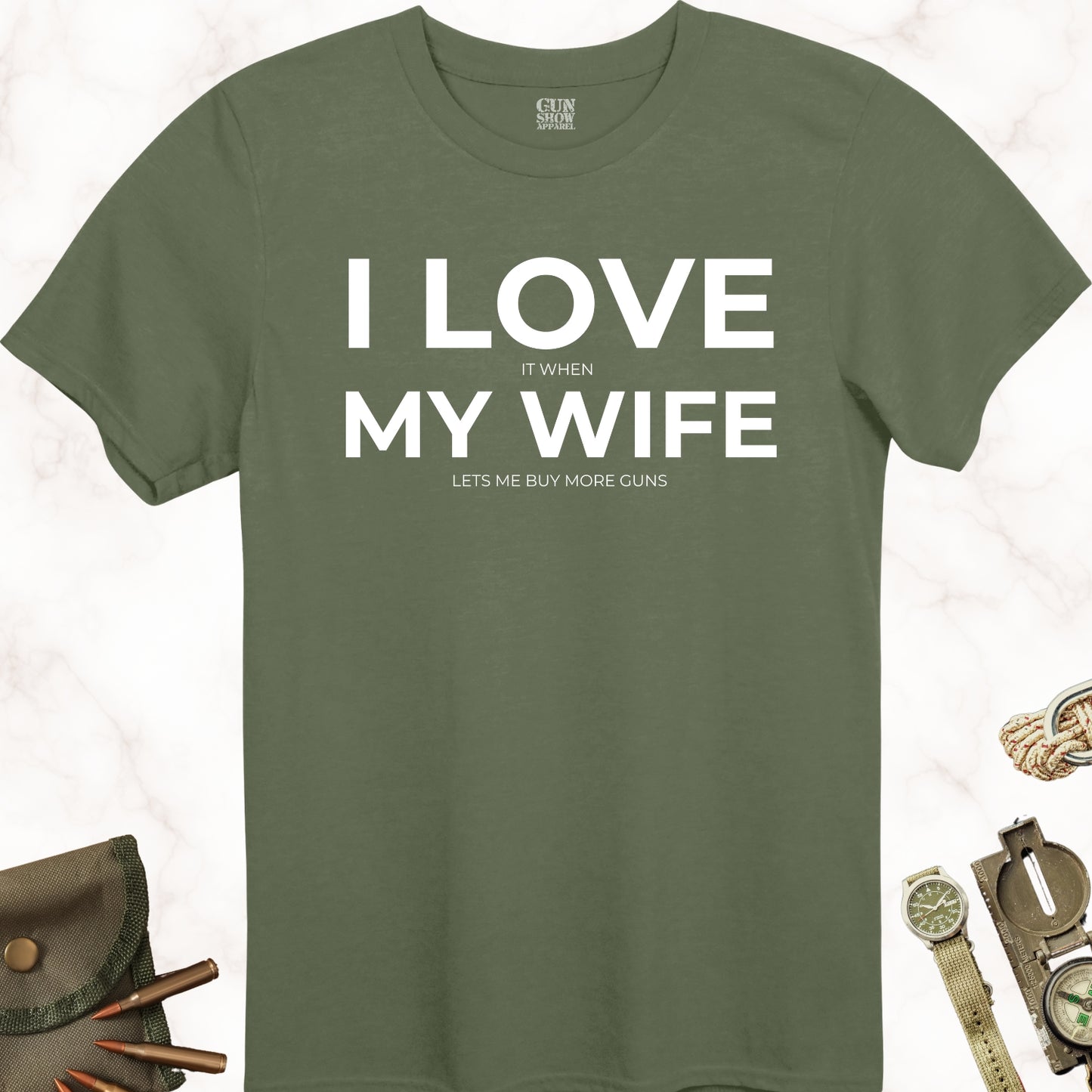 I Love It When My Wife Lets Me Buy More Guns T-Shirt in color Military Green with white design by Gun Show Apparel