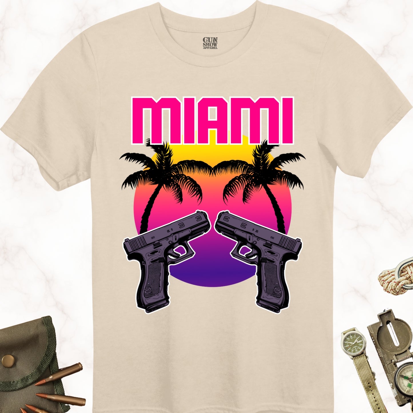 Miami Sunset Gun T-Shirt with Palm Trees and Dual Pistols in color Sand