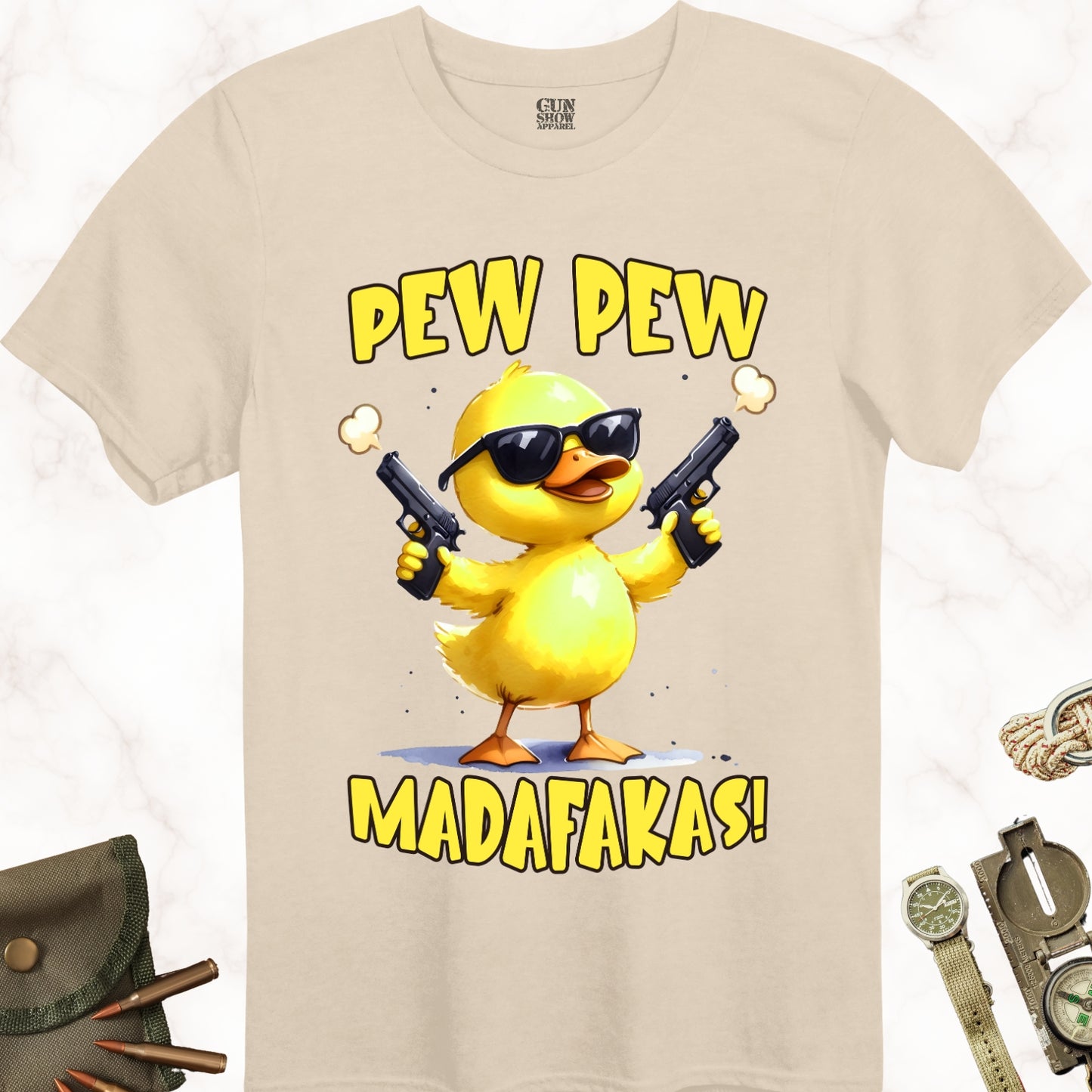 Pew Pew Madafakas Duck wearing sunglasses and holding a gun in each hand t-shirt in color Sand